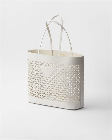 prada laser cut bag|White Large Perforated Leather Tote Bag .